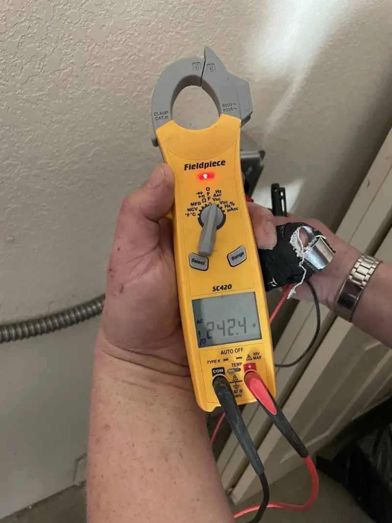 Voltage testing with clamp meter during Generator Installation in Buda